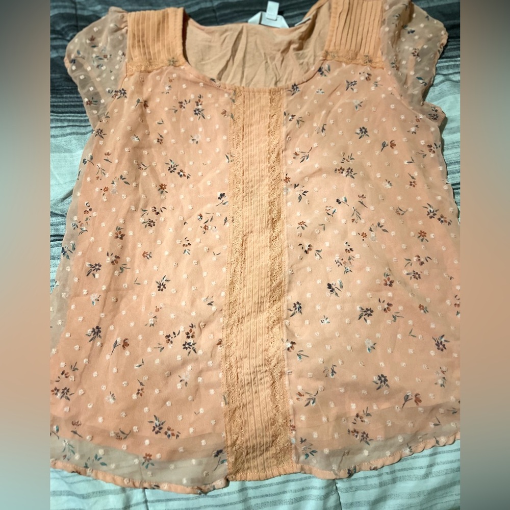Lauren Conrad size large fits like medium dress shirt.